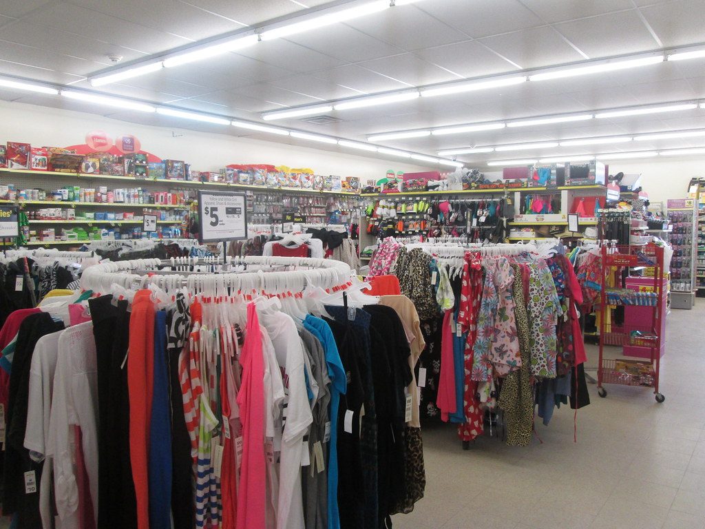 A rail of clothes inside a retail store