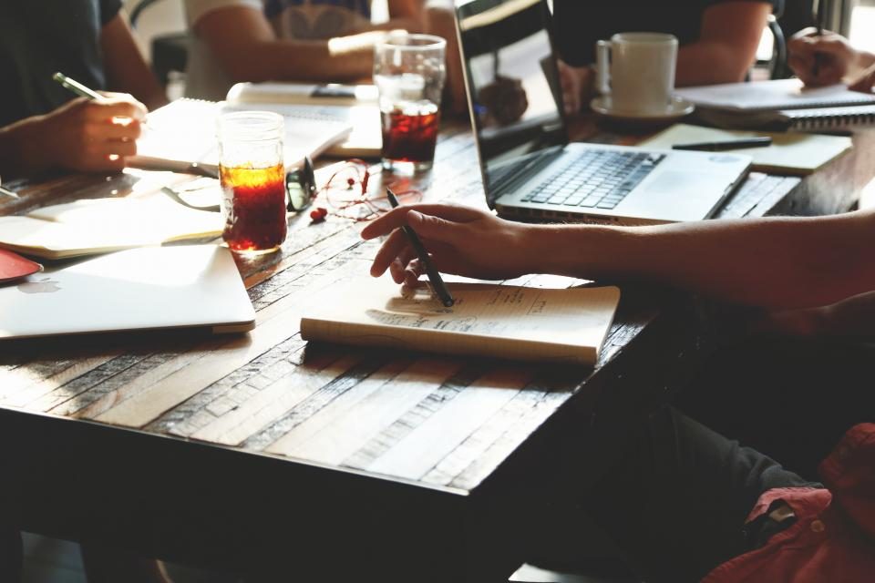 A small team working together around a table